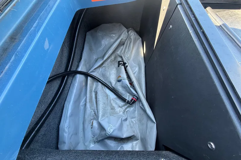 Slide: The Image of Storage compartment of 2023 Axis T220 boat with hose and cover. - 69