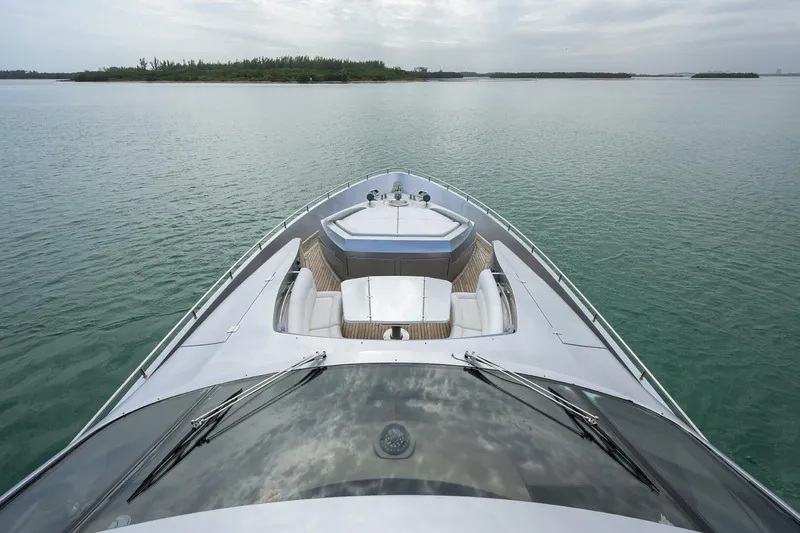 Slide: The Image of The 2009 Pershing 90 features a sleek design with a spacious foredeck and luxurious seating areas. - 47
