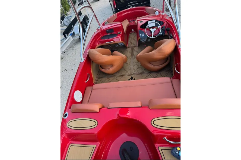 Slide: The Image of Red Cary 16 boat interior, 2000 model, featuring tan leather seats and modern dashboard. - 4
