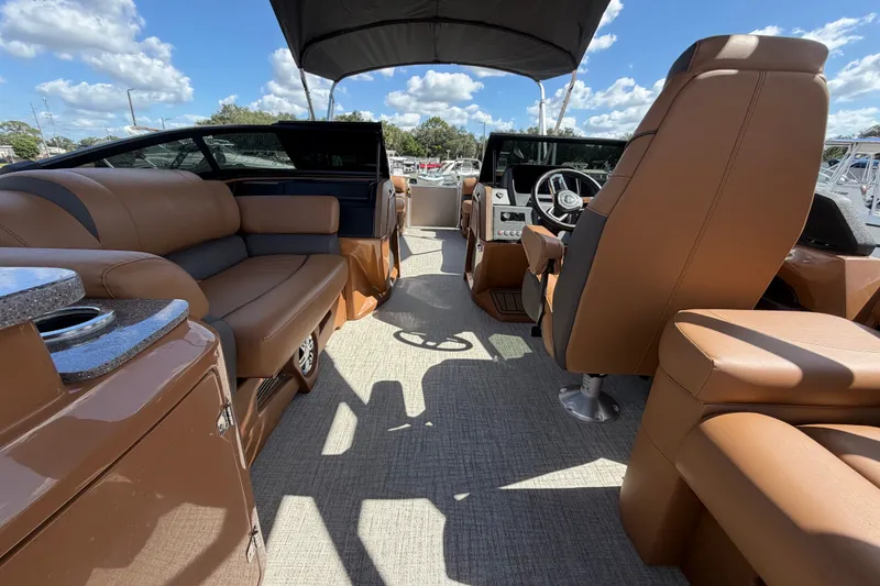 Slide: The Image of Luxurious interior of 2025 Avalon Excalibur LTD Quad Lounge boat under a sunny sky. - 34