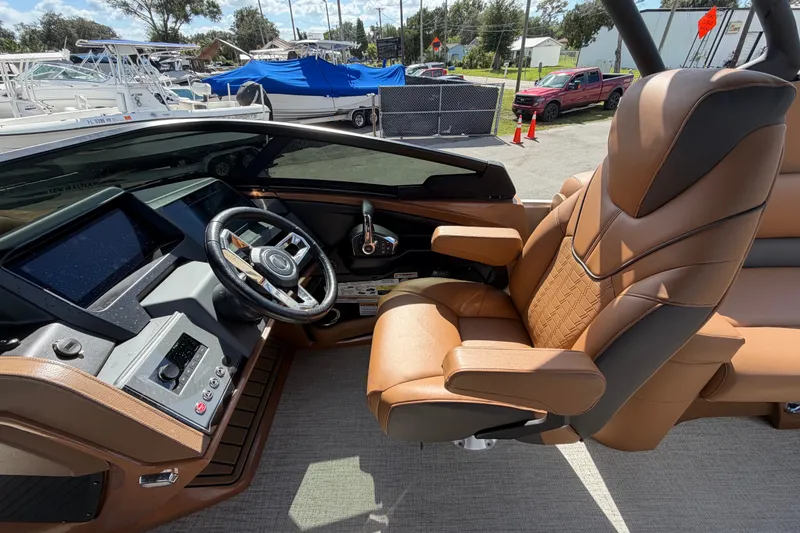 Slide: The Image of Luxurious cockpit of 2025 Avalon Excalibur LTD Quad Lounge boat with leather seating. - 42