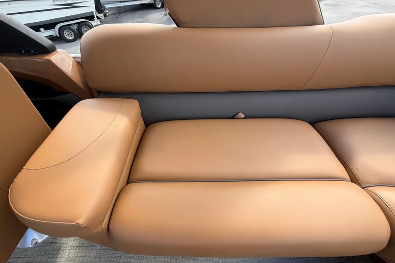 Slide: The Image of Luxurious tan seating in 2025 Avalon Excalibur LTD Quad Lounge boat. - 82