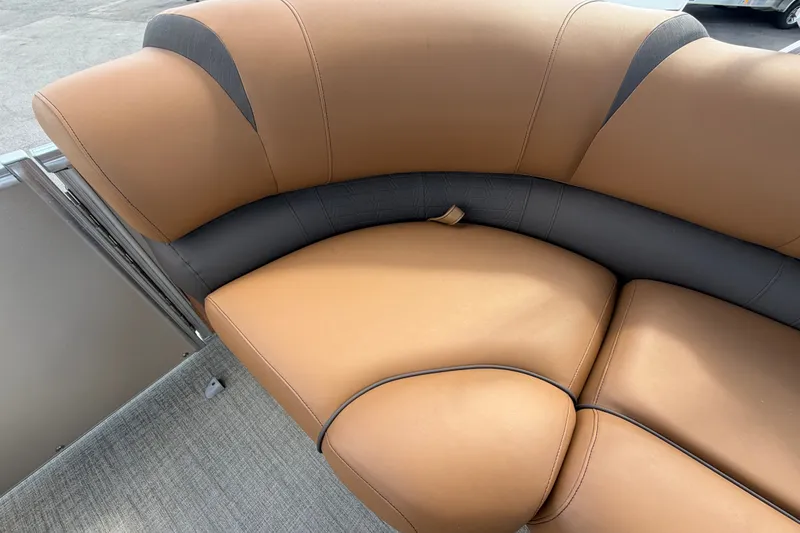 Slide: The Image of Luxurious tan and black seating on 2025 Avalon Excalibur LTD Quad Lounge boat. - 62