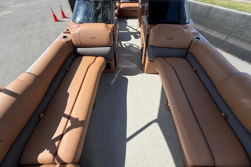 Slide: The Image of Luxurious interior of 2025 Avalon Excalibur LTD Quad Lounge boat with tan seating. - 69