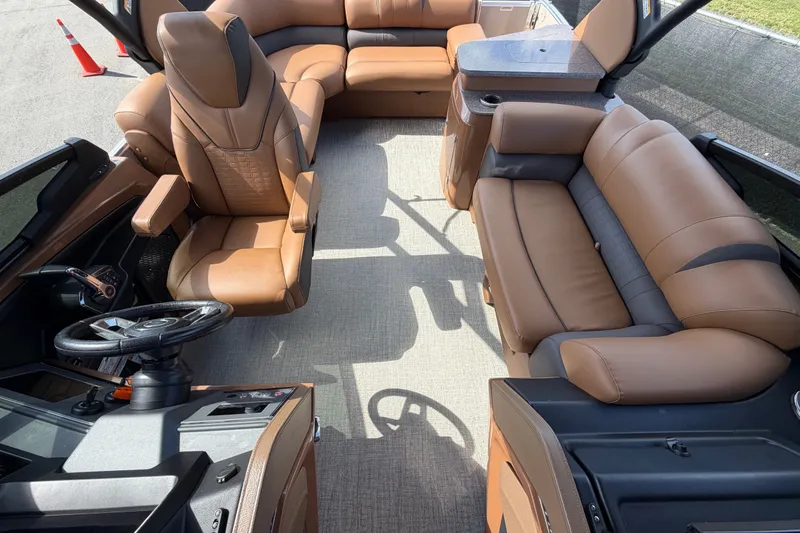 Slide: The Image of Luxurious interior of 2025 Avalon Excalibur LTD Quad Lounge boat with plush seating. - 74