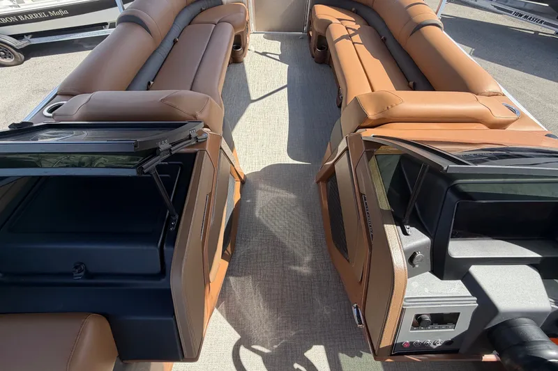 Slide: The Image of Luxurious seating in a modern boat with brown upholstery and sleek consoles. - 50