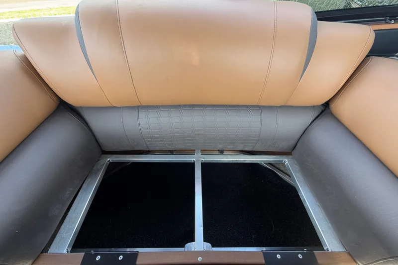 Slide: The Image of 2025 Avalon Excalibur LTD Quad Lounge interior seating with storage compartment. - 38