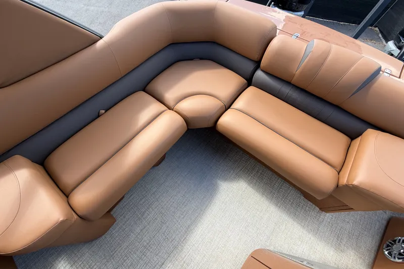 Slide: The Image of Luxurious seating on 2025 Avalon Excalibur LTD Quad Lounge Windshield boat, featuring tan upholstery. - 81