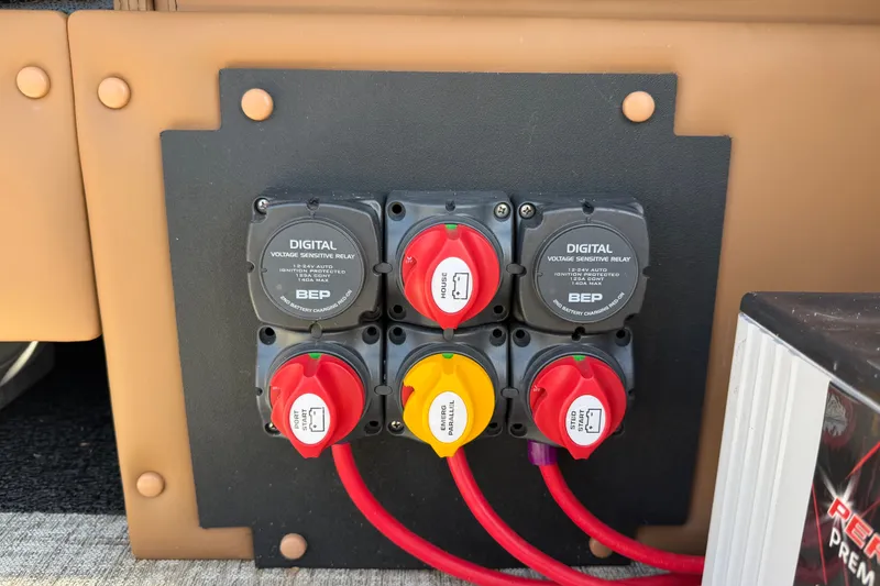 Slide: The Image of Electrical panel with digital voltage sensitive relays on a 2025 Avalon Excalibur LTD Quad Lounge. - 21