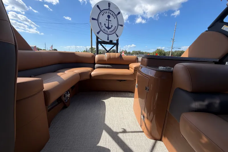 Slide: The Image of Luxurious interior of 2025 Avalon Excalibur LTD Quad Lounge boat under clear blue sky. - 78