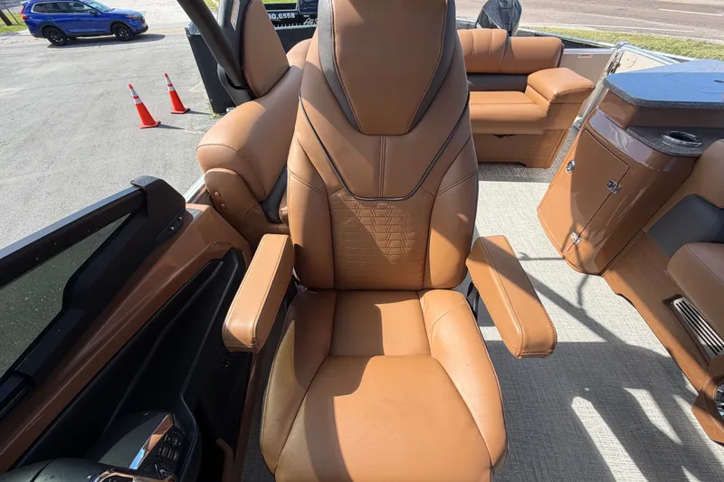 Slide: The Image of Luxurious brown seating on 2025 Avalon Excalibur LTD Quad Lounge boat. - 76