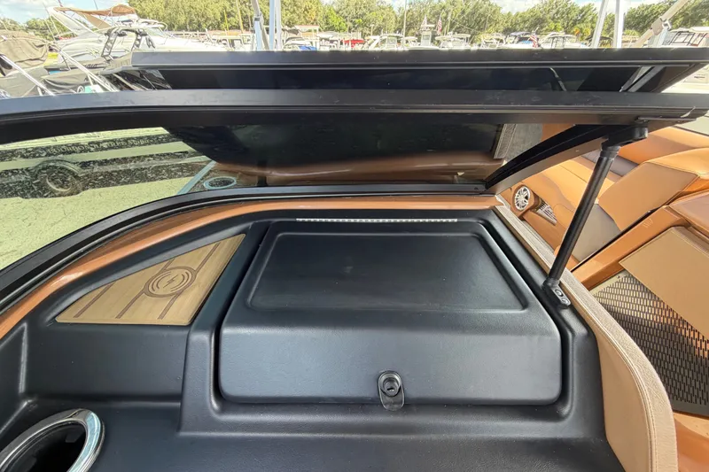 Slide: The Image of 2025 Avalon Excalibur LTD Quad Lounge Windshield interior storage compartment open. - 40