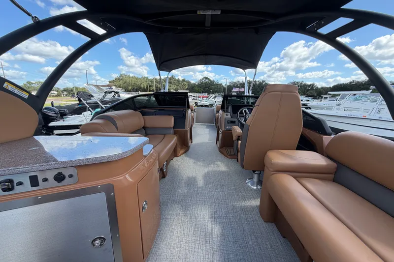 Slide: The Image of 2025 Avalon Excalibur LTD Quad Lounge boat interior with luxurious seating and modern design. - 24