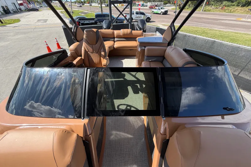 Slide: The Image of 2025 Avalon Excalibur LTD Quad Lounge boat with windshield, featuring luxurious seating and modern design. - 73