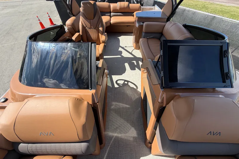 Slide: The Image of 2025 Avalon Excalibur LTD Quad Lounge Windshield boat interior with luxurious seating. - 72