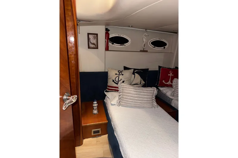 Slide: The Image of Cozy cabin interior of 1999 Azimut 52 yacht with nautical-themed decor. - 6