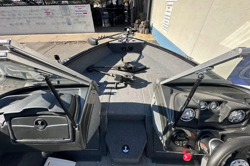Slide: The Image of 2020 Tracker Pro Guide V-175 Combo boat interior with steering console and open windshield. - 29