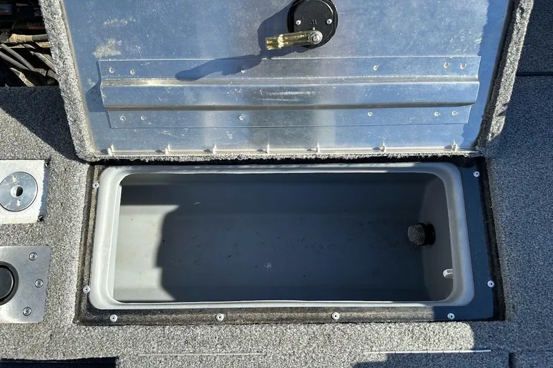 Slide: The Image of Open storage compartment in 2020 Tracker Pro Guide V-175 Combo boat. - 16