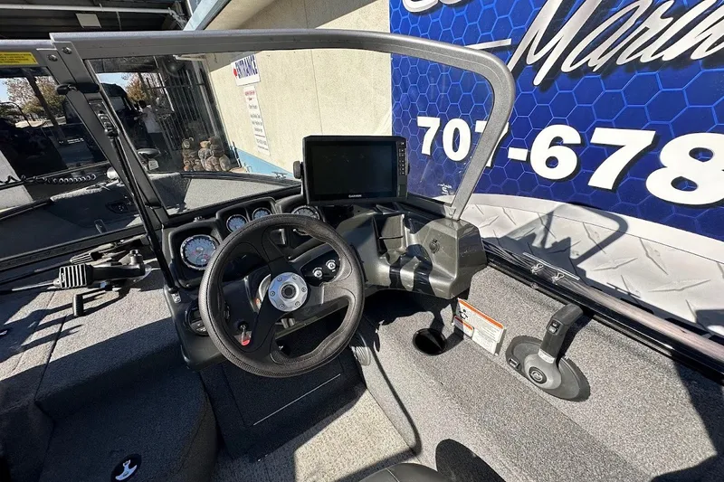 Slide: The Image of 2020 Tracker Pro Guide V-175 Combo boat dashboard with steering wheel and gauges. - 21