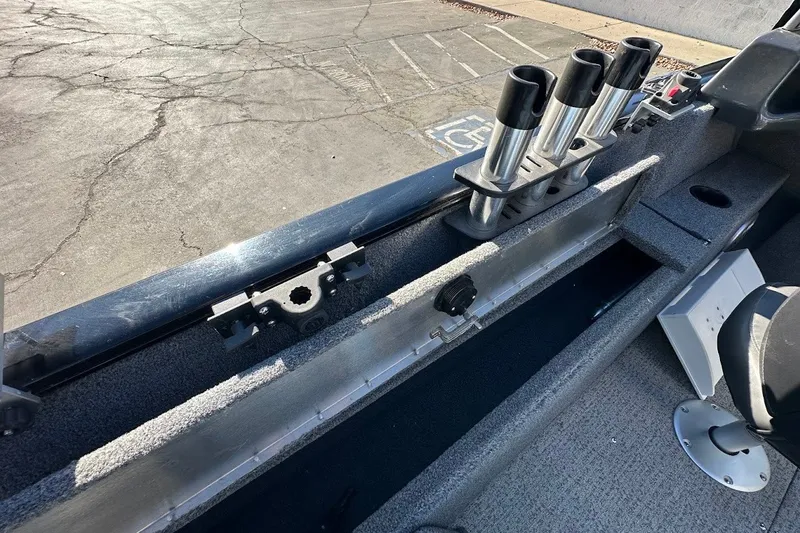 Slide: The Image of 2020 Tracker Pro Guide V-175 Combo boat interior with rod holders and storage compartment. - 18