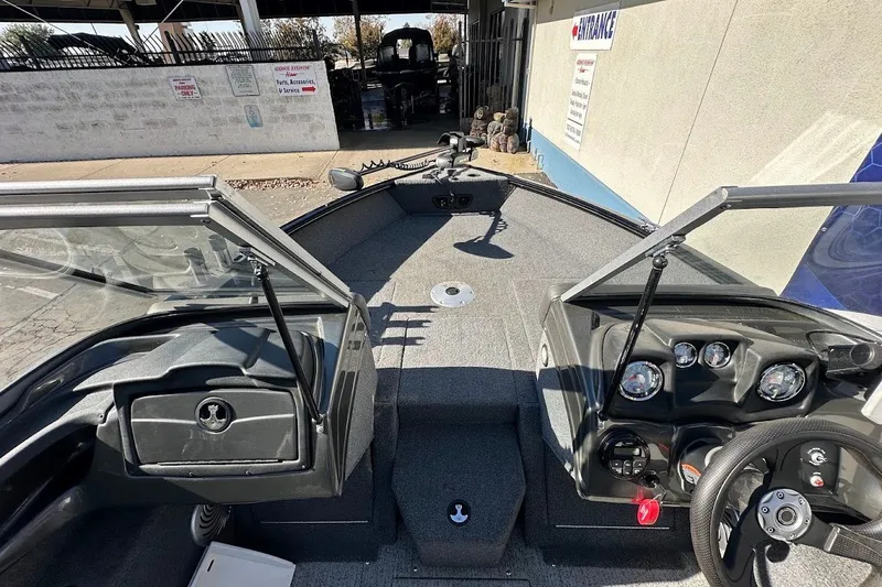 Slide: The Image of 2020 Tracker Pro Guide V-175 Combo boat interior with steering wheel and dashboard controls. - 31