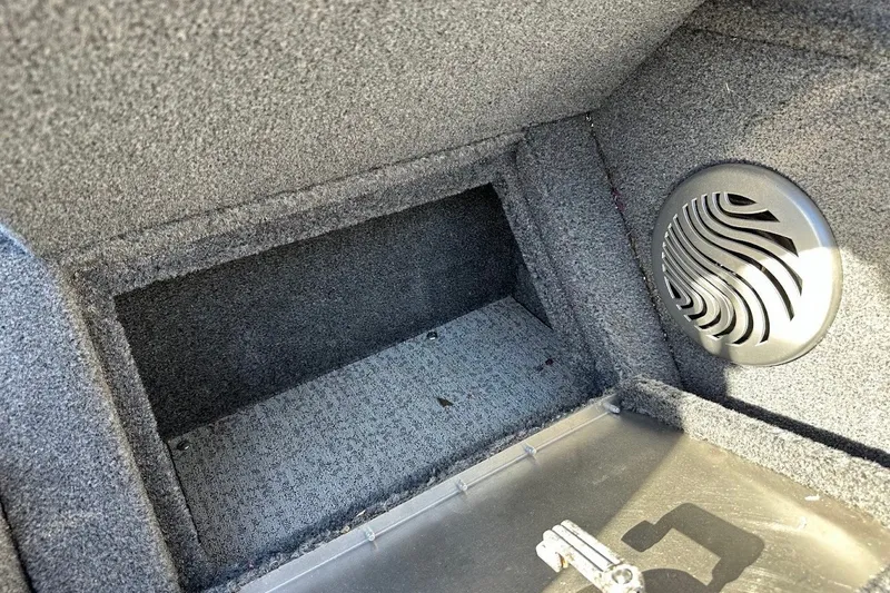 Slide: The Image of 2020 Tracker Pro Guide V-175 Combo interior storage compartment with speaker detail. - 28