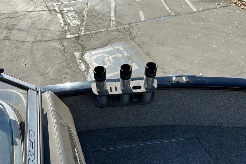 Slide: The Image of 2020 Tracker Pro Guide V-175 Combo boat with rod holders, parked in a lot. - 34