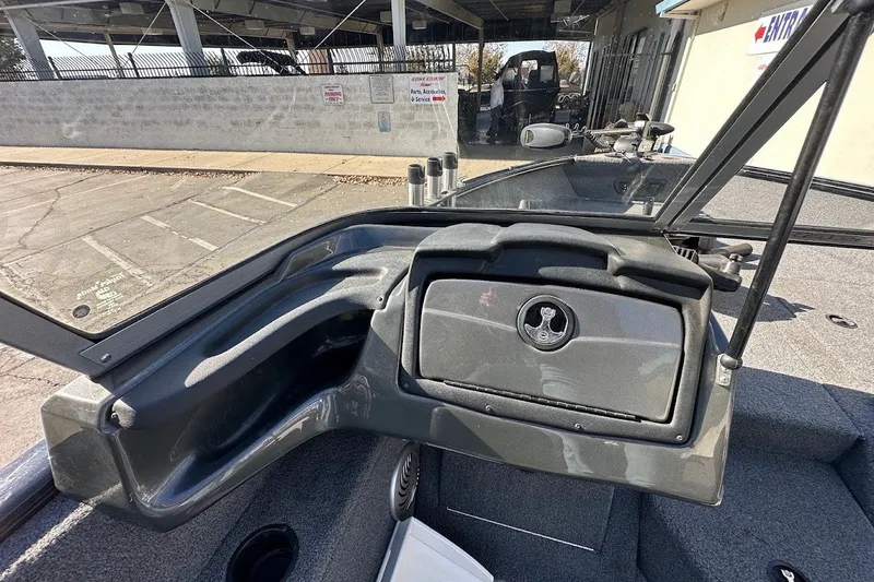Slide: The Image of 2020 Tracker Pro Guide V-175 Combo boat interior with storage compartment and windshield. - 20