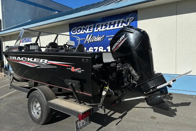 The Image of 2020 Tracker Pro Guide V-175 Combo boat with Mercury engine at a marine dealership. - 0