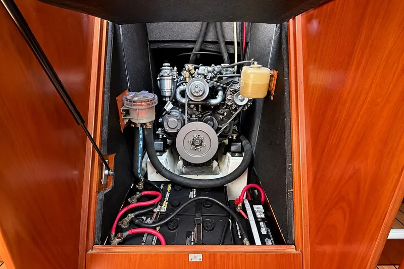 Slide: The Image of Engine compartment of a 2005 Beneteau Oceanis 473 sailboat, showcasing mechanical components. - 38