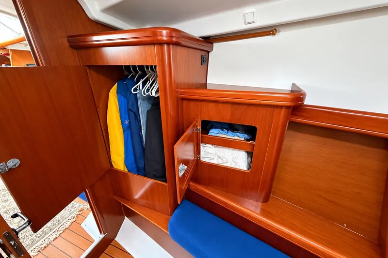 Slide: The Image of Wooden cabin interior of 2005 Beneteau Oceanis 473 yacht with closet and storage. - 30