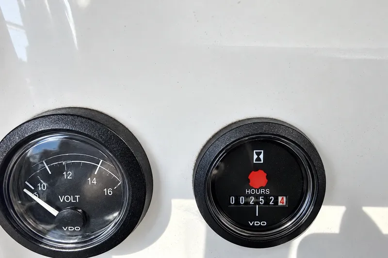 Slide: The Image of Volt and hour meters on 2005 Beneteau Oceanis 473 yacht dashboard. - 40