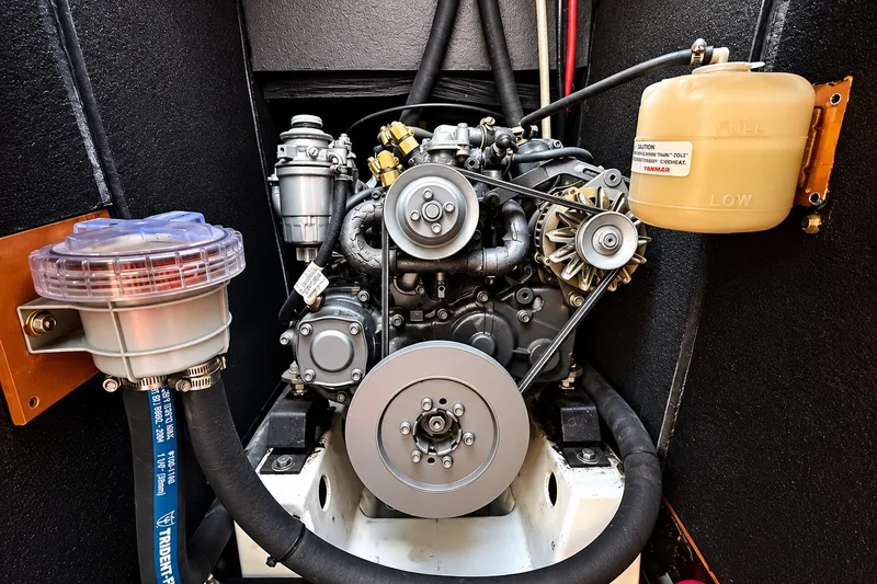 Slide: The Image of Engine compartment of a 2005 Beneteau Oceanis 473 sailboat, featuring a Yanmar engine. - 39