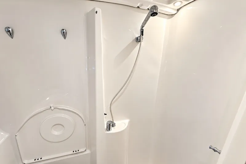 Slide: The Image of Shower area in 2005 Beneteau Oceanis 473 yacht, featuring sleek white design and modern fixtures. - 33