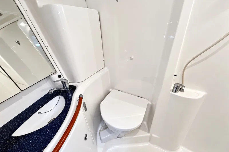 Slide: The Image of Bathroom interior of 2005 Beneteau Oceanis 473 yacht, featuring sink and toilet. - 31