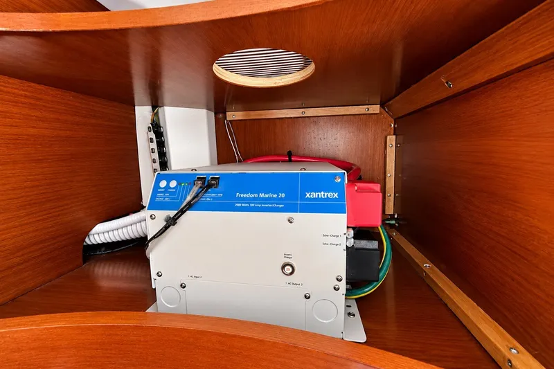 Slide: The Image of Electrical system inside 2005 Beneteau Oceanis 473 yacht, featuring Xantrex Freedom Marine 20 inverter. - 26