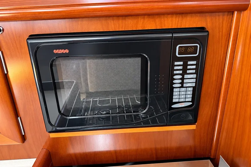 Slide: The Image of Built-in microwave in 2005 Beneteau Oceanis 473 yacht kitchen. - 19
