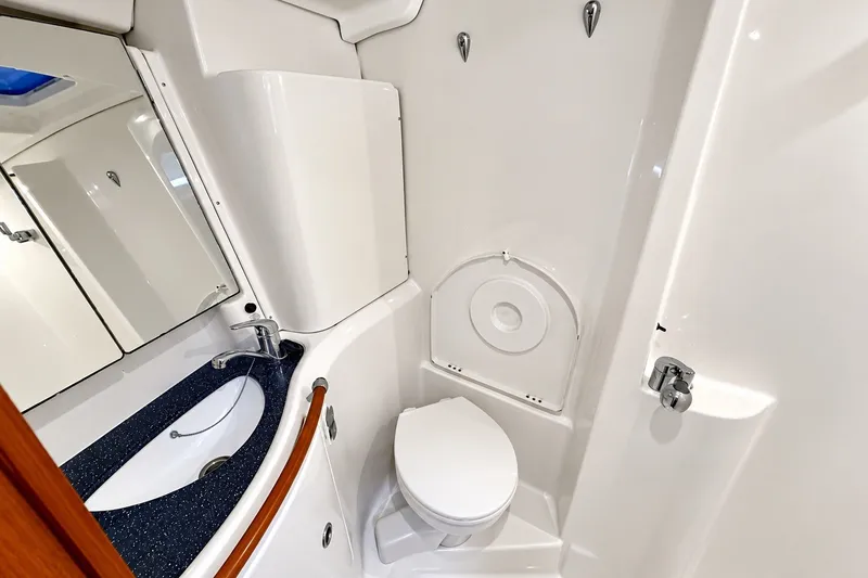 Slide: The Image of Bathroom interior of 2005 Beneteau Oceanis 473 yacht, featuring sink and toilet. - 32