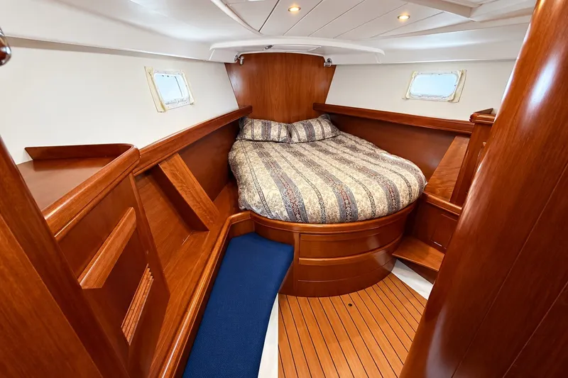 Slide: The Image of Luxurious cabin interior of 2005 Beneteau Oceanis 473 sailboat with wood finish. - 27