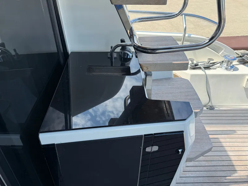 Slide: The Image of The 2019 Cranchi E 52S Evoluzione features a sleek staircase and a glossy black surface. - 10