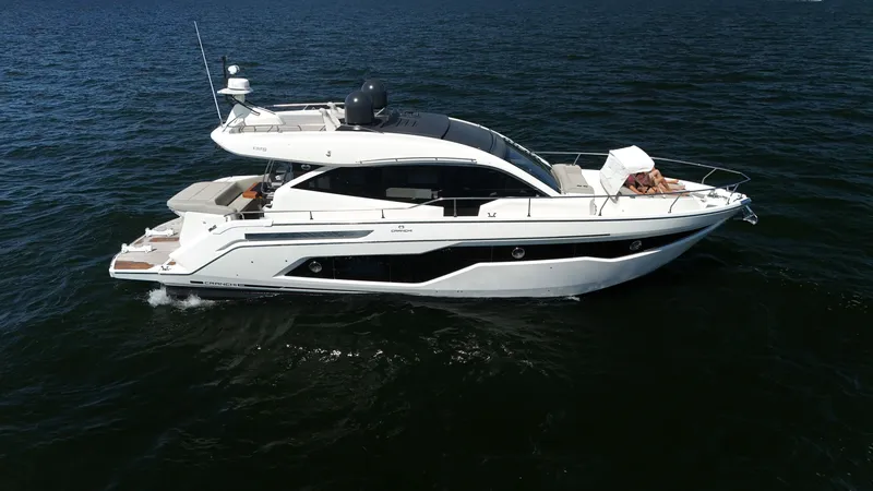 Slide: The Image of 2019 Cranchi E 52S Evoluzione on calm water, featuring sleek design and modern structure. - 1