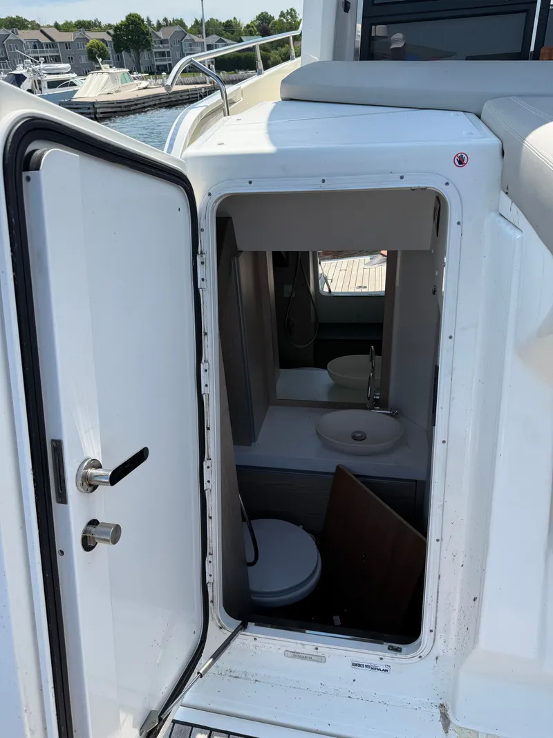 Slide: The Image of 2019 Cranchi E 52S Evoluzione with an open door to the onboard toilet. - 14