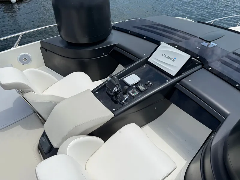 Slide: The Image of The image shows the cockpit of a 2019 Cranchi E 52S Evoluzione with modern controls. - 24