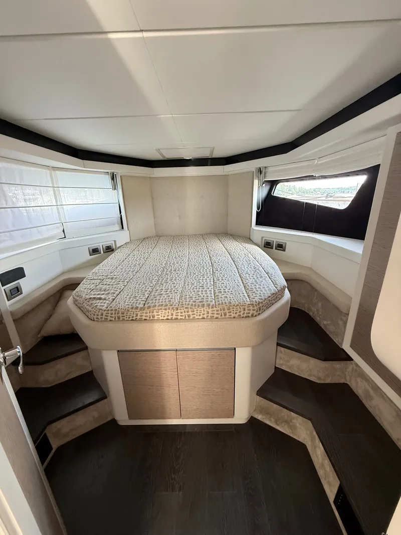 Slide: The Image of Cabin of the 2019 Cranchi E 52S Evoluzione with a large bed and modern details. - 44