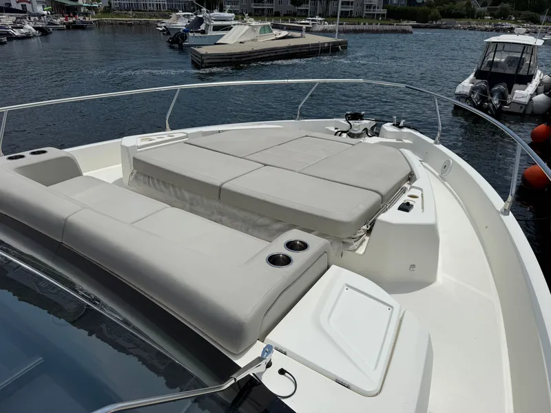 Slide: The Image of The image shows the deck of a 2019 Cranchi E 52S Evoluzione with lounging areas. - 17