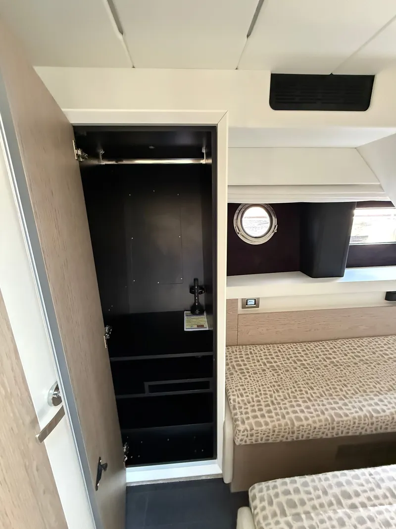 Slide: The Image of Interior of the 2019 Cranchi E 52S Evoluzione with a closet and two beds. - 43