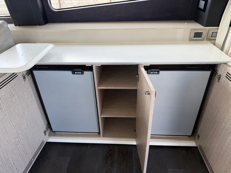 Slide: The Image of Interior of the 2019 Cranchi E 52S Evoluzione with cabinets and refrigerators. - 33