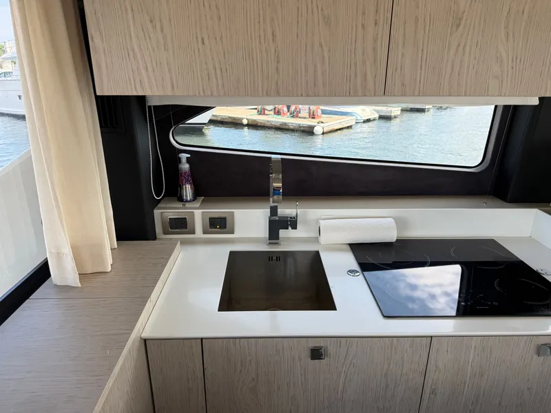 Slide: The Image of Modern kitchen in a 2019 Cranchi E 52S Evoluzione with sink and cooktop. - 31