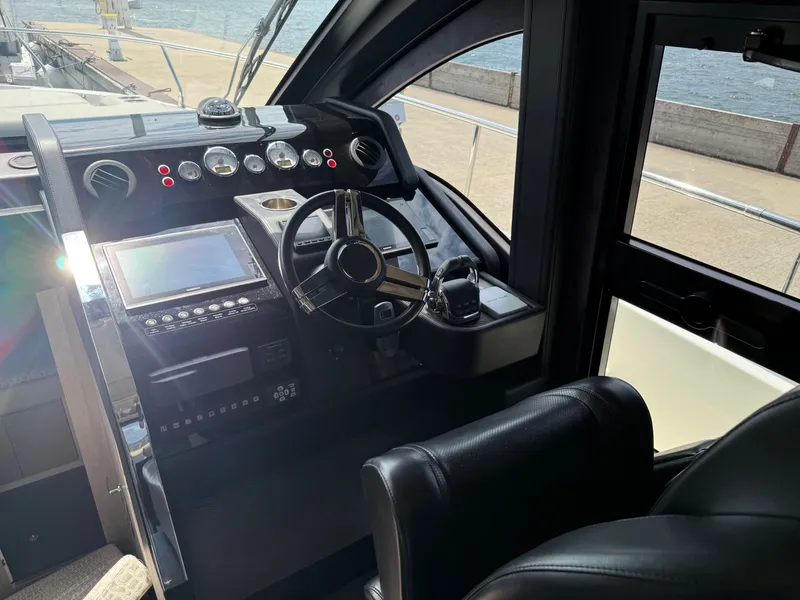 Slide: The Image of The image shows the cockpit of a 2019 Cranchi E 52S Evoluzione with modern instruments. - 34