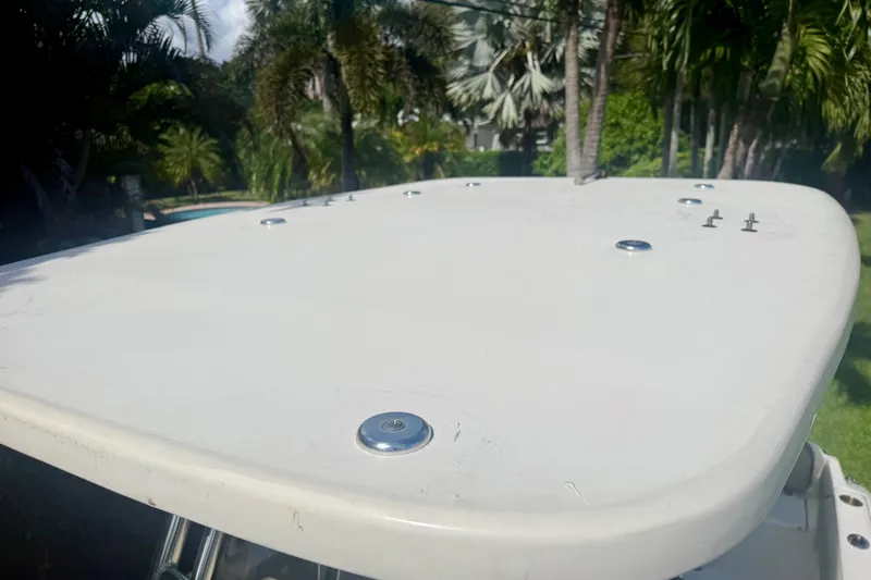 Slide: The Image of 2023 Key West 239 FS boat deck with lush greenery in the background. - 17